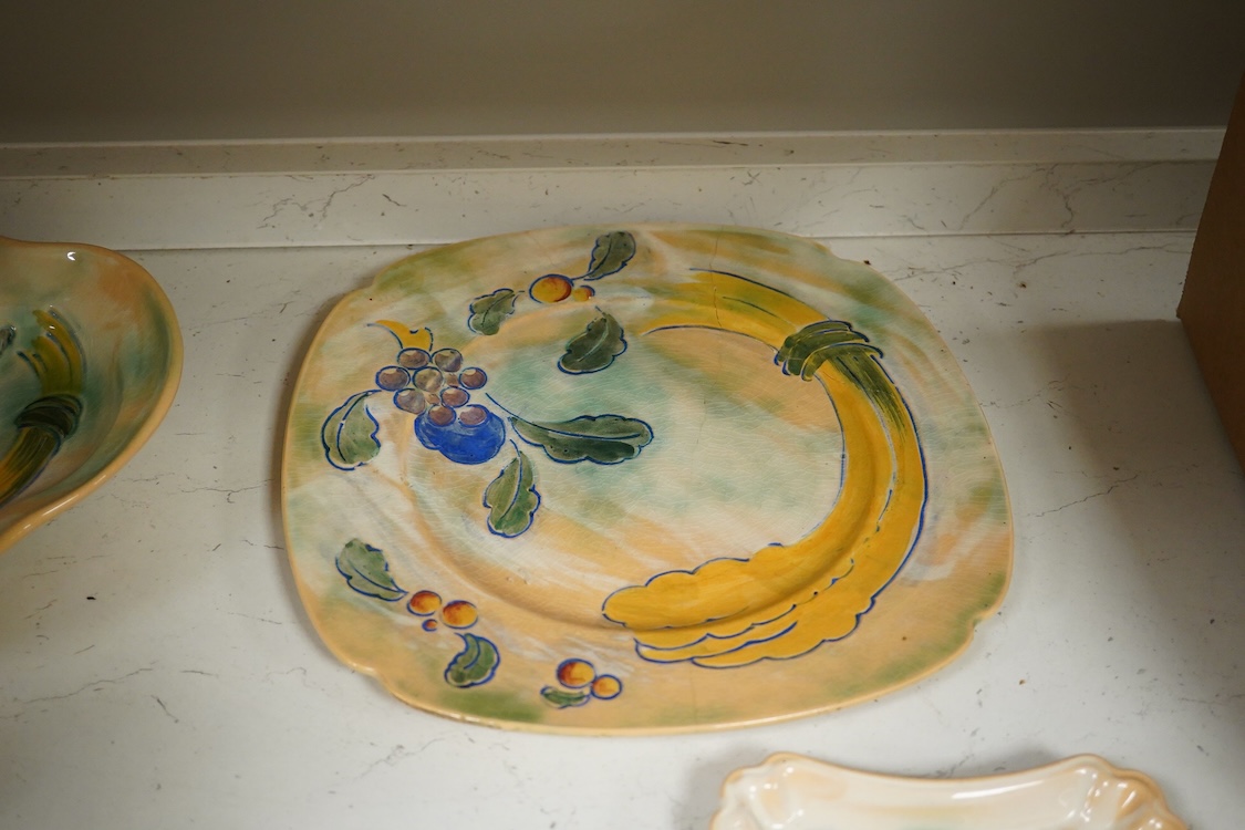 A collection of Doulton Brangwynware to include an oval dish, wall plate and two coffee cans and saucers, largest 32cm in diameter